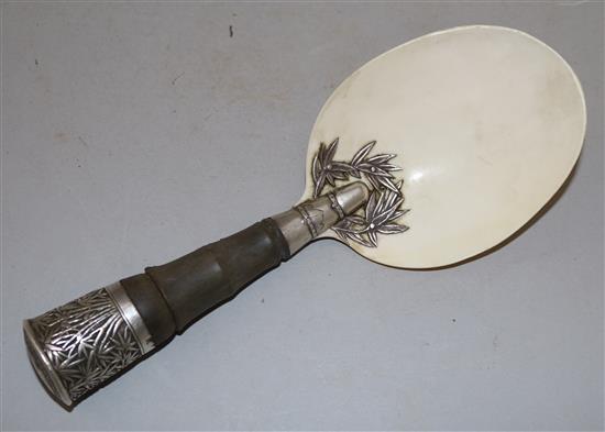 A Chinese silver mounted rhinoceros horn handled serving spoon, late 19th century, length 20cm